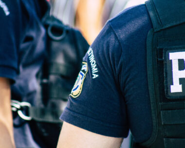 View of Greek police officers standing front the entry of the Acropolis of Athens in the afternoon