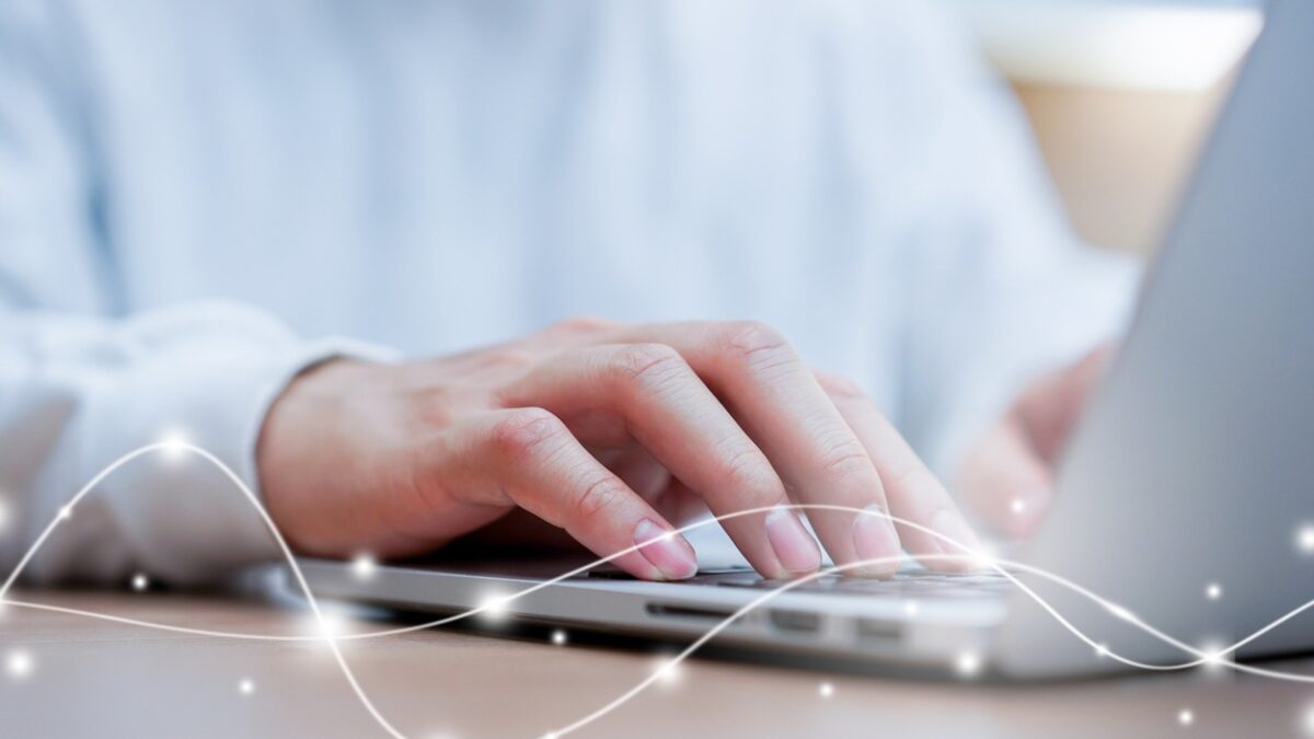close up network man typing on keyboard laptop to access internet with virtual interface fiber optical telecommunication to exchange data information in the cyber network for business and futuristic technology communication concept