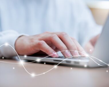 close up network man typing on keyboard laptop to access internet with virtual interface fiber optical telecommunication to exchange data information in the cyber network for business and futuristic technology communication concept