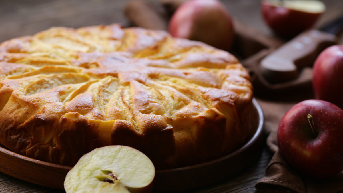homemade fresh apple pie on a wooden plate