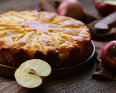 homemade fresh apple pie on a wooden plate