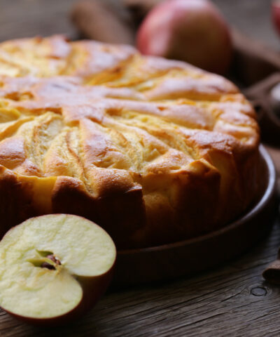 homemade fresh apple pie on a wooden plate
