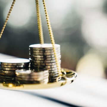 Coins stack with balance scale. Money management, financial plan, time value of money, business idea and Creative ideas for saving money concept