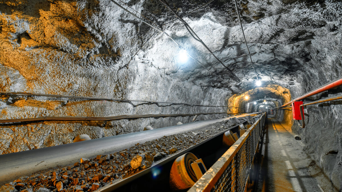 Belt conveyor in an underground tunnel. Transportation of ore to the surface.