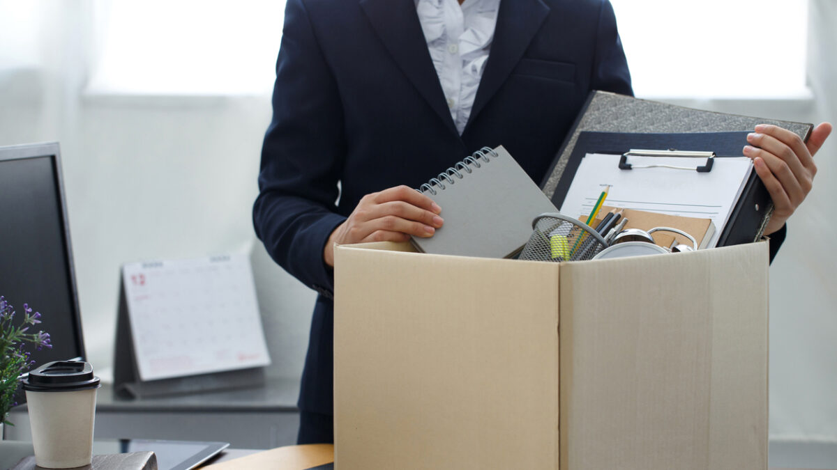 Resignation concept.Businesswoman packing personal company belongings when she deciding resignation change of job or fired from the company.