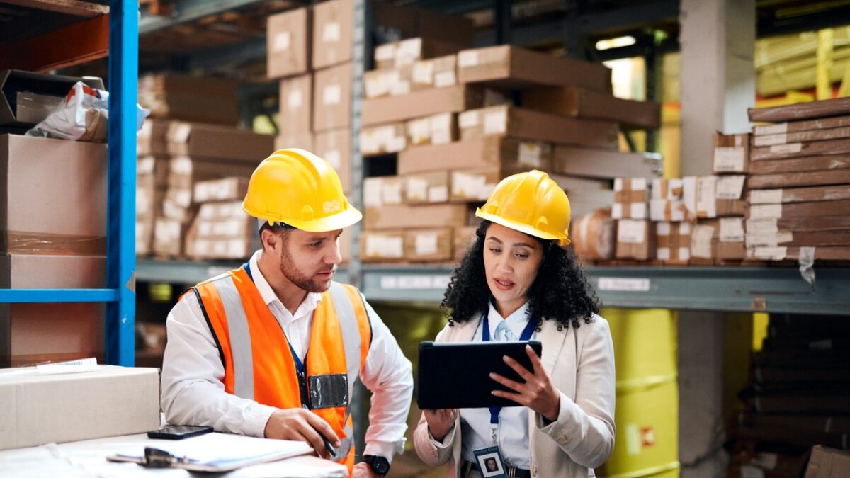 Warehouse, tablet and people teamwork for storage, inventory and supply chain management for b2b distribution. Factory, Industry partner or worker on digital technology, software and logistics boxes