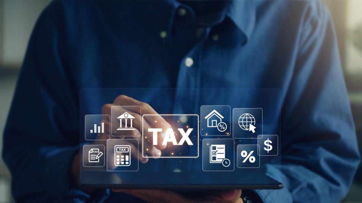 E-tax, A Businessman using a tablet to fill in the income tax online return form for payment.Calculation of tax return.Government, state taxes. Data analysis, paperwork, financial research, reports.