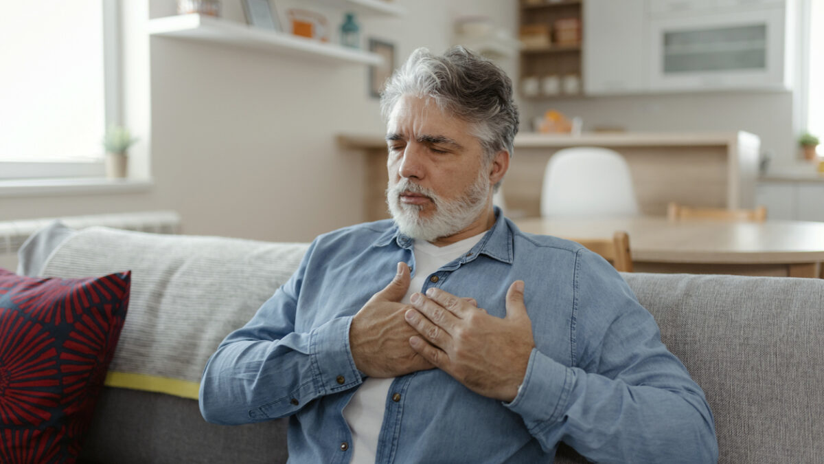 Mature man having heart attack at home
