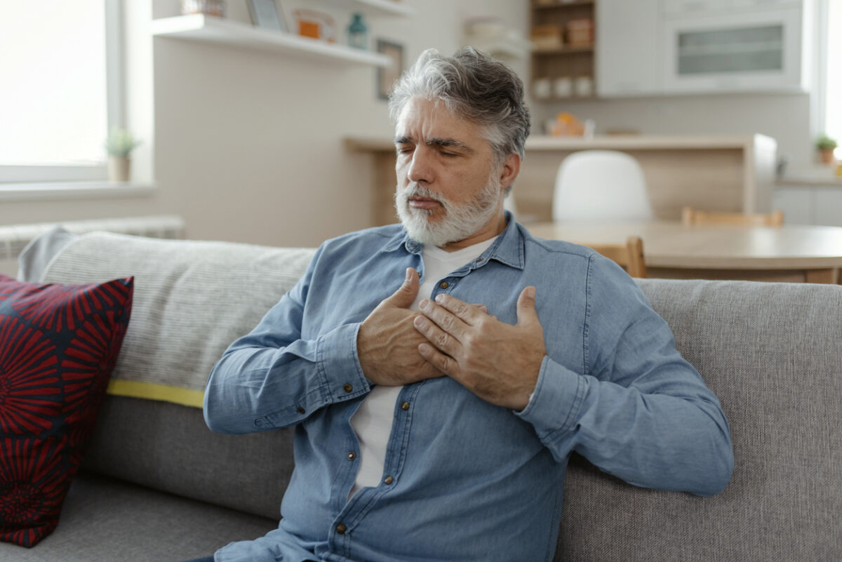 Mature man having heart attack at home