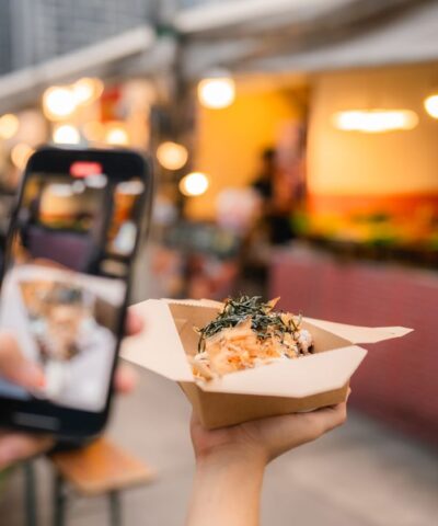 Asian couple eating on the street food at outdoor market
