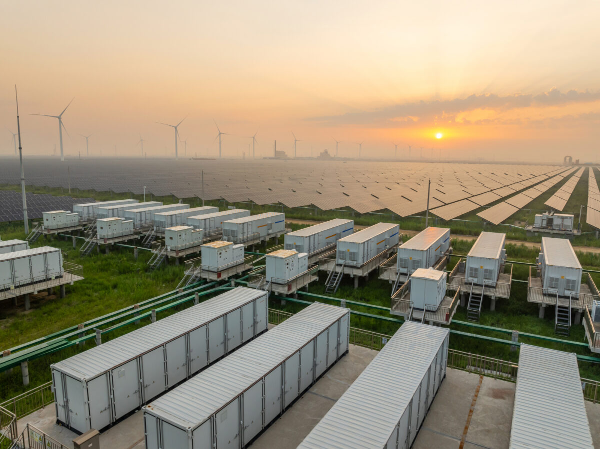 Energy storage power station, solar power station and wind power station at sunrise
