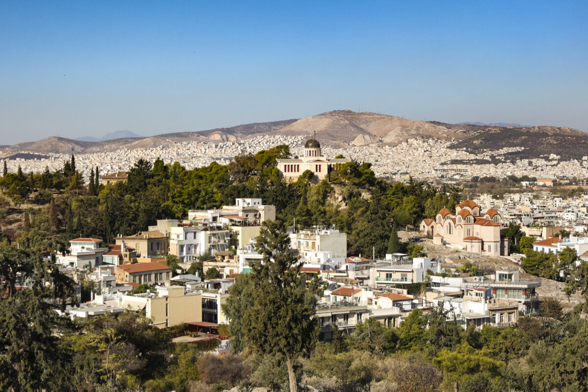 High angle view of National Observatory of Athens (Thissio Visitor Center) and Church of Agia Marina in Athens, Greece.