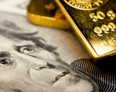 Close-up of a 20-dollar banknote (figuring president Jackson) and a gold bullion
