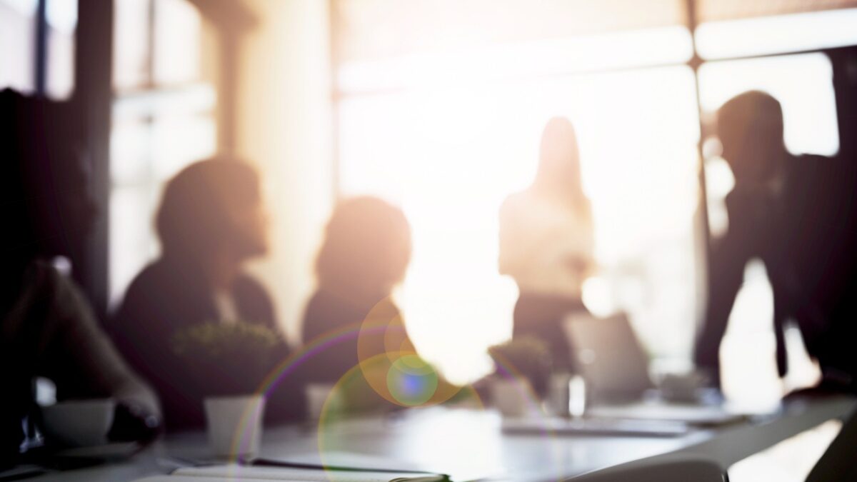 Shot of a group of business colleagues talking together during a meeting in a boardroom