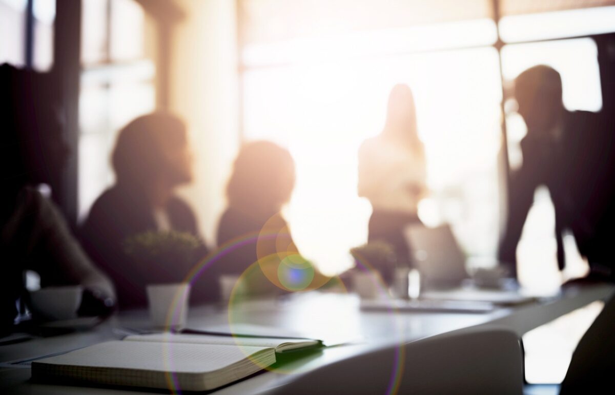 Shot of a group of business colleagues talking together during a meeting in a boardroom