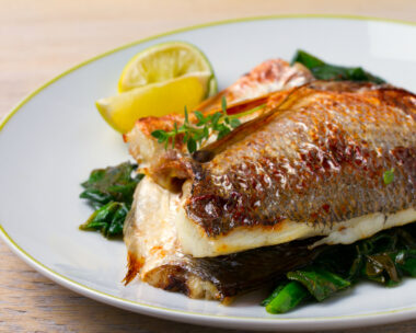 Dorado or dorada fish fillet with spinach, thyme and lime, horizontal