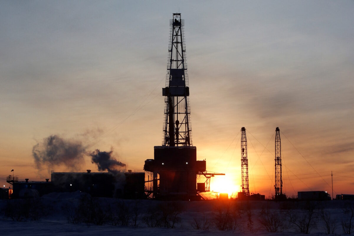 FILE PHOTO: A general view shows an drilling rig at the Lukoil company owned Imilorskoye oil field, as the sun rises, outside the West Siberian city of Kogalym, Russia, January 25, 2016. REUTERS
