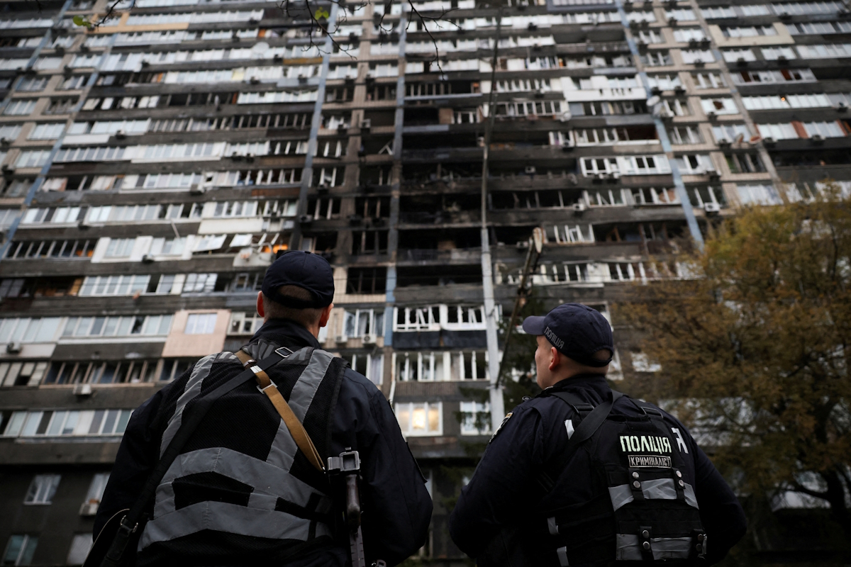Police investigators are investigating an apartment building that suffered damage during Russian drone and rocket attack in Kiev