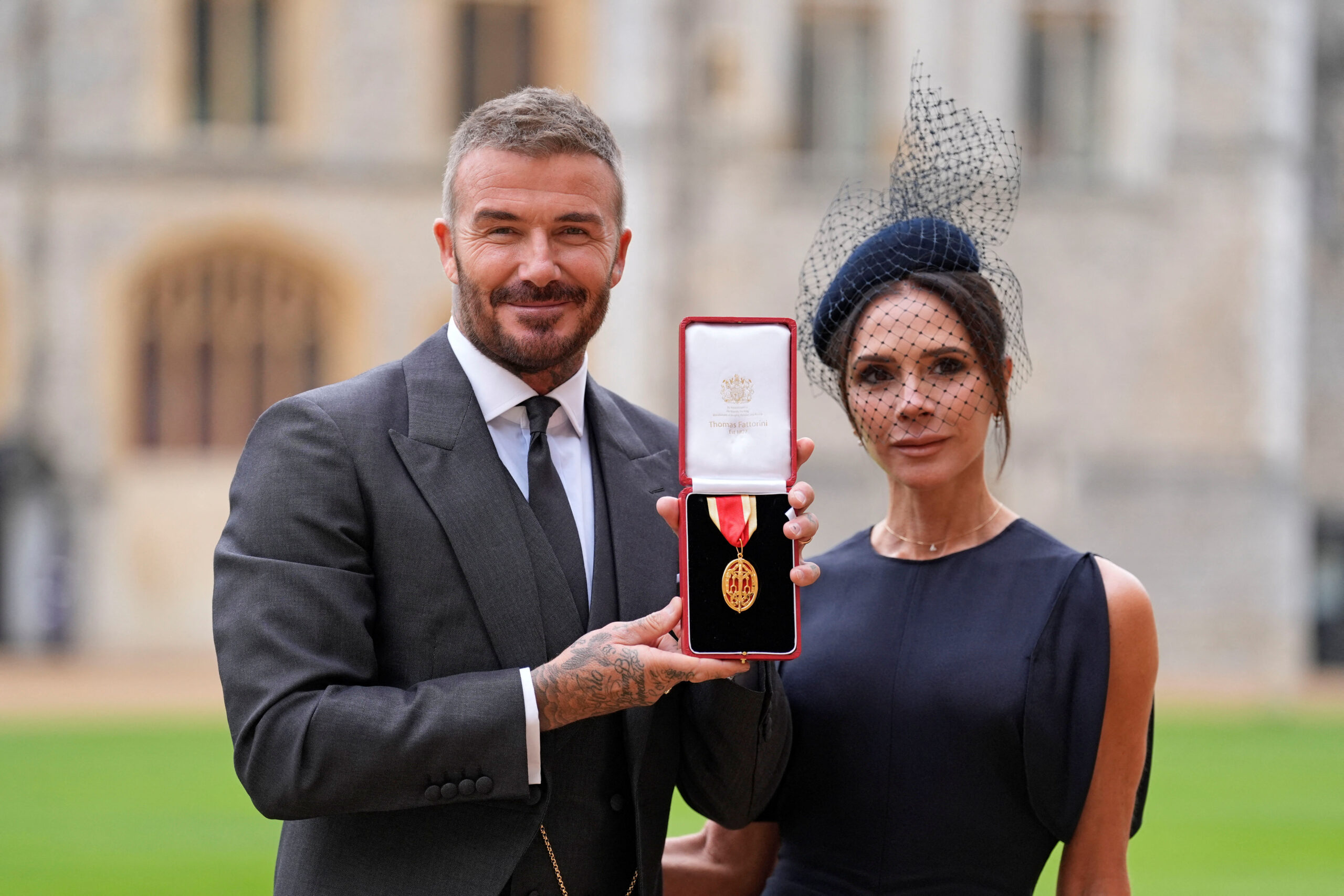 Sir David Beckham, stands with his wife Lady Victoria, after he was made a Knight Bachelor at an investiture ceremony at Windsor Castle, Berkshire. November 4, 2025. Andrew Matthews