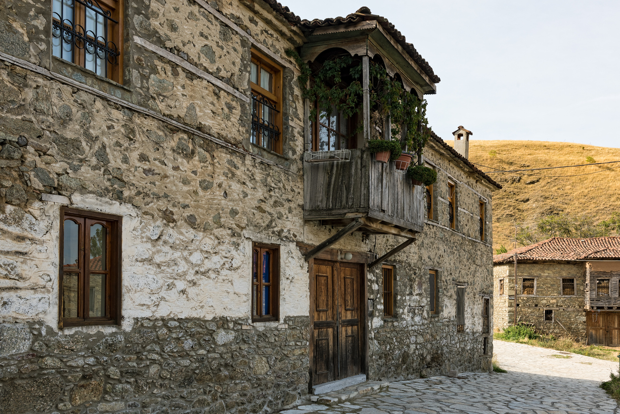 Stone buildings of traditional architecture on September 24, 2017 in Agios Germanos village in the area of Prespes Lakes in Greece