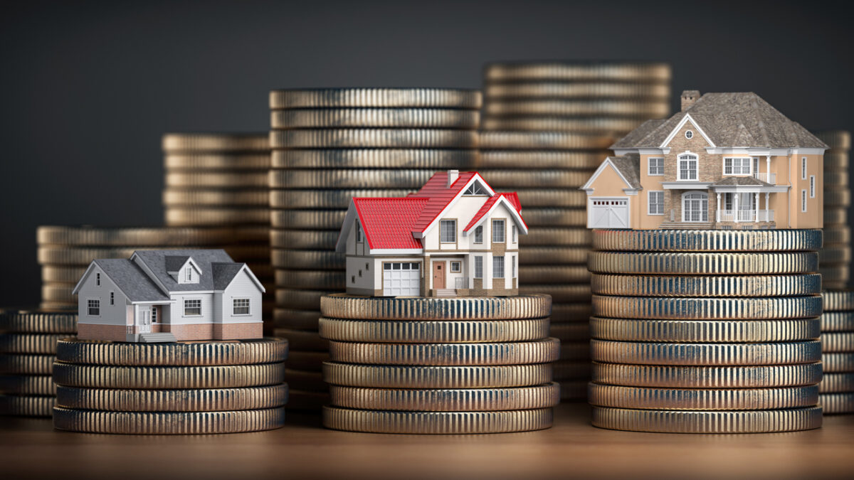 Houses of different size with different value on stacks of coins. Concept of property, mortgage and real estate investment. 3d illustration