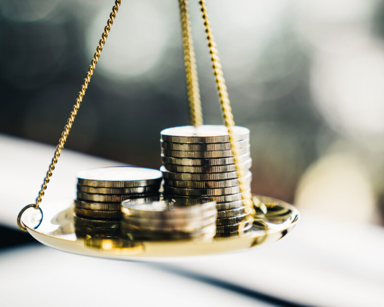 Coins stack with balance scale