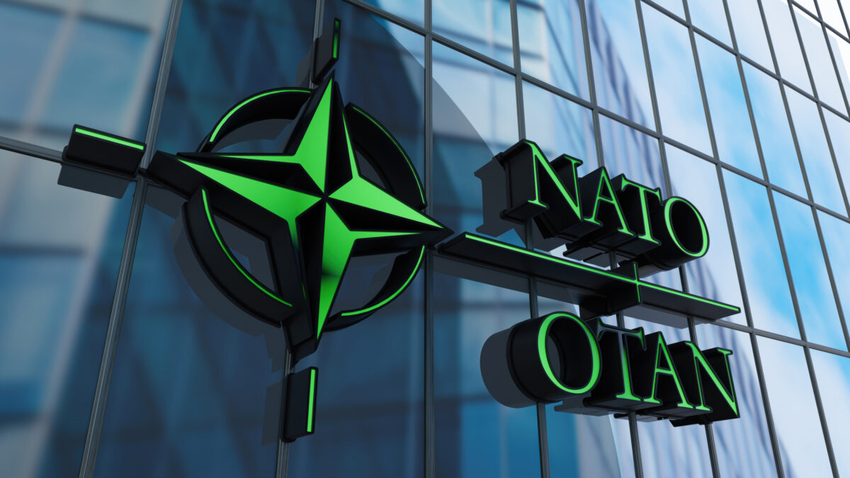 NATO OTAN Sign on Building's Window. 3D Render