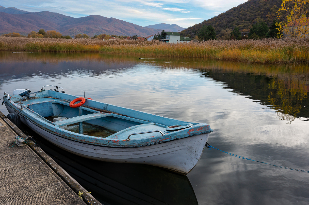 Traditional wooden fishing boat at the Mikri Prespa lake, Greece