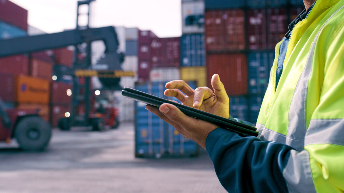 Hand, worker and tablet for shipping outdoor for cargo crane, inventory inspection and delivery safety of logistics. Person, digital and container information, transport service and distribution site