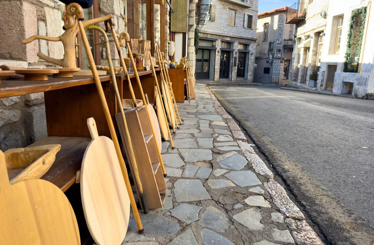 Greece Arachova village, locla products shops at the center of small town, street view. Tourist resort, sunny summer day