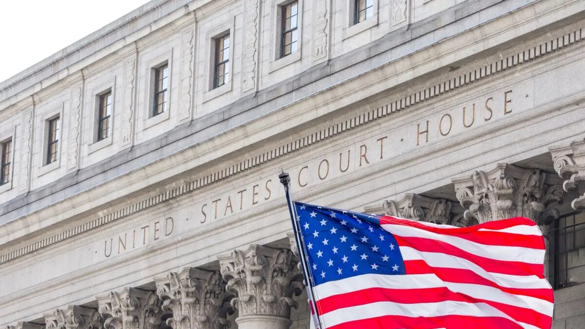 USA national flag waving in the wind in front of United States Court House in New York, USA