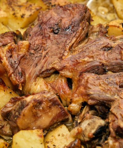 Greek roasted goat and potatoes—a dish that embodies tradition and indulgence! The goat, slow-roasted to tender, flavorful perfection, paired with golden potatoes soaking up all the savory juices and herbs like oregano and thyme, creates a culinary masterpiece. A touch of garlic, olive oil, and a squeeze of lemon elevate this feast to unforgettable heights. It’s a celebration of simplicity and rich Mediterranean flavors.