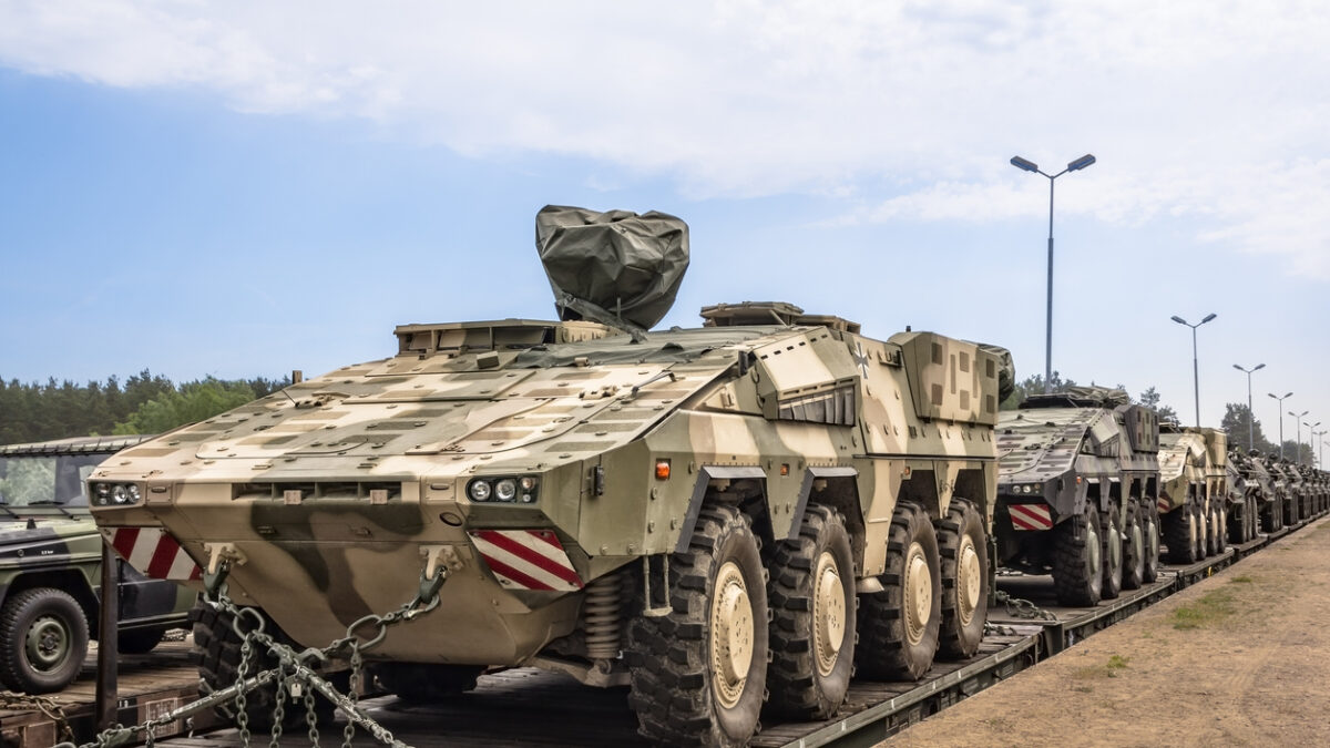 German military equipment on a railway siding. German soldiers are preparing for the maneuvers codenamed „Saber Strike-15” on the military training area in Drawsko Pomorskie, Poland.