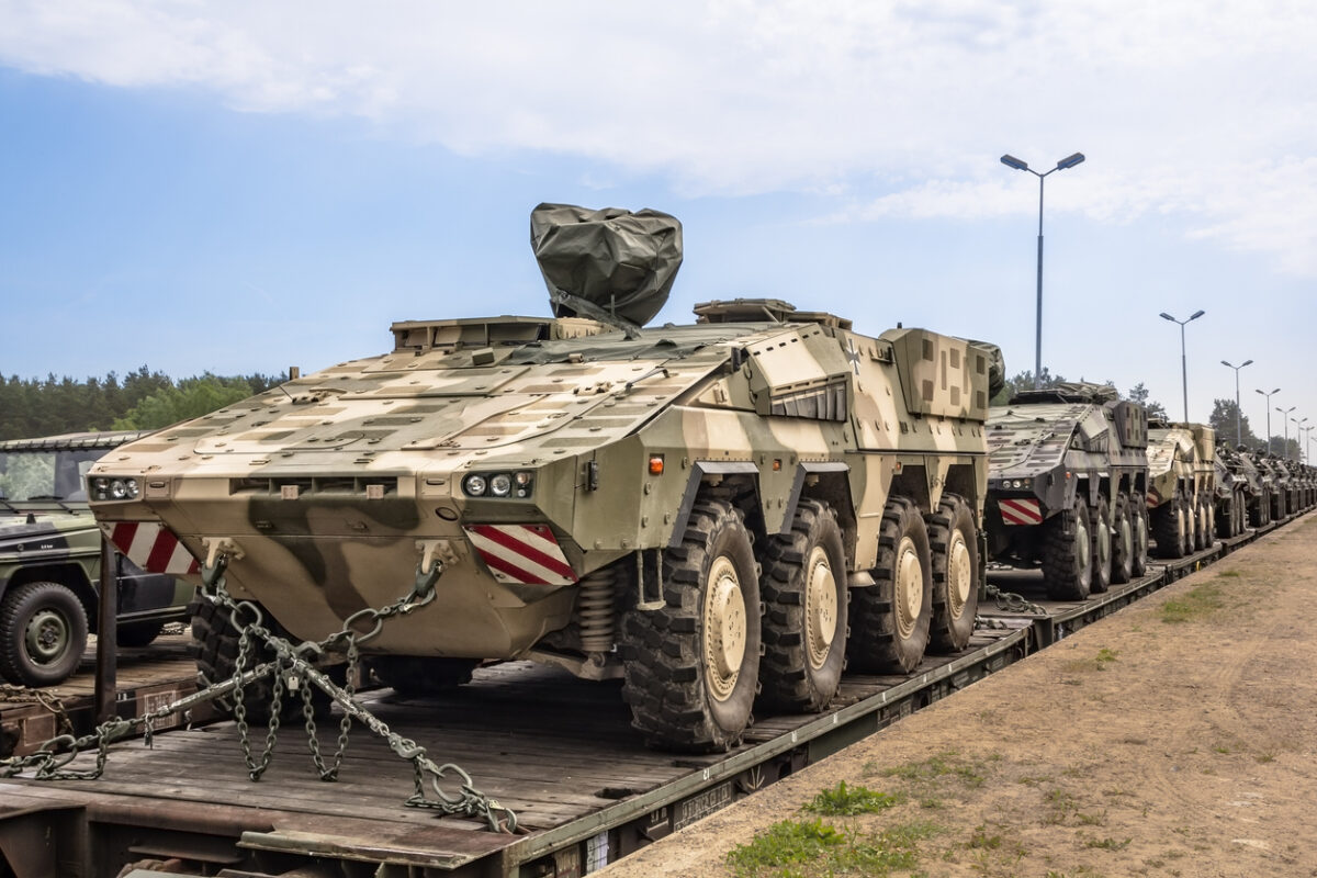 German military equipment on a railway siding. German soldiers are preparing for the maneuvers codenamed „Saber Strike-15” on the military training area in Drawsko Pomorskie, Poland.
