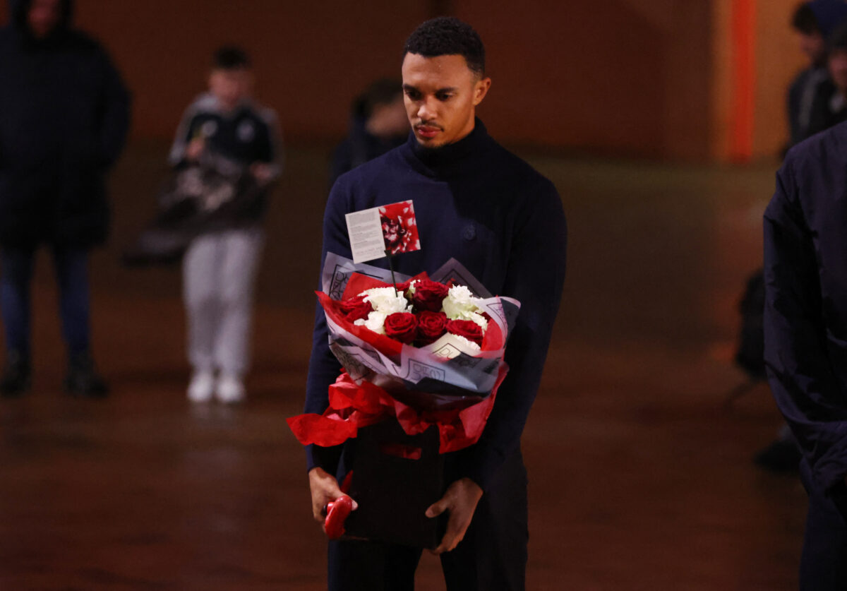 Soccer Football - UEFA Champions League - Real Madrid pay tribute to Diogo Jota - Anfield, Liverpool, Britain - November 3, 2025 Real Madrid's Trent Alexander-Arnold lays a wreath for former teammate Diogo Jota at his memorial outside Anfield Action Images via Reuters
