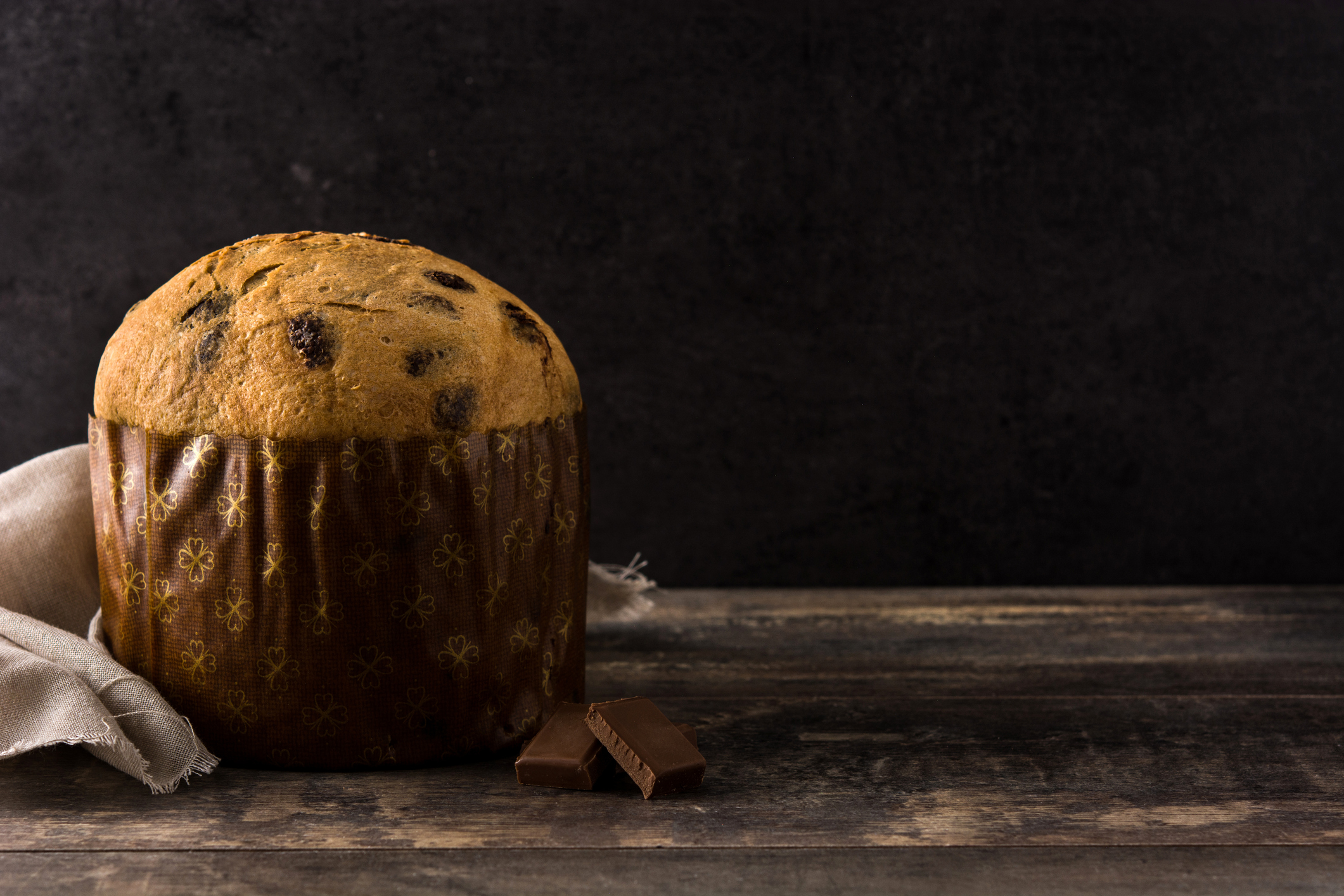 Christmas chocolate panettone cake on wooden table