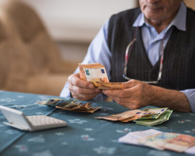 Close-up of a senior man counting money in European Union currency