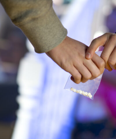 ecstasy being handed over at a house party..