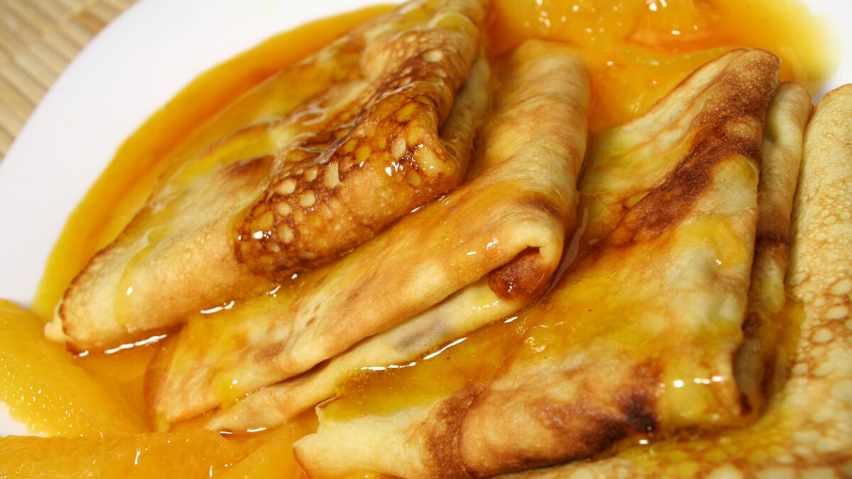 French pancakes with a thick and sweet orange sauce