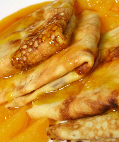 French pancakes with a thick and sweet orange sauce