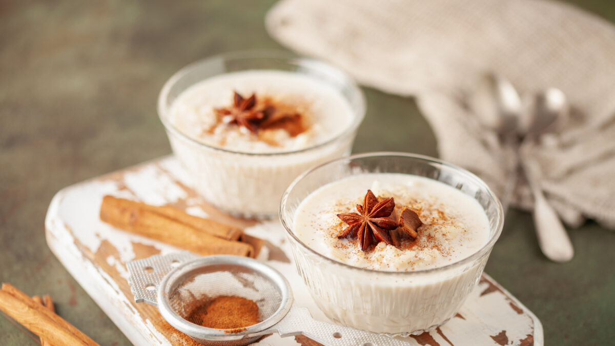 Spanish rice pudding Arroz con Leche in glass cream bowl on the table