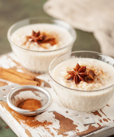 Spanish rice pudding Arroz con Leche in glass cream bowl on the table