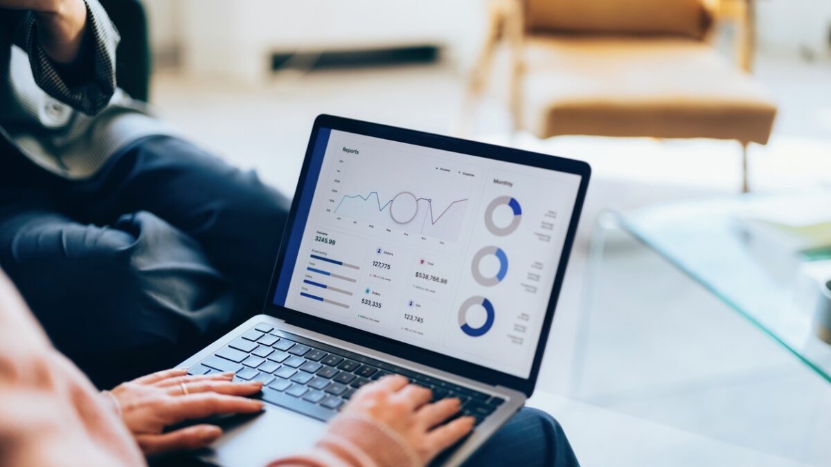 Focused on a laptop, showcasing detailed analytics and reports