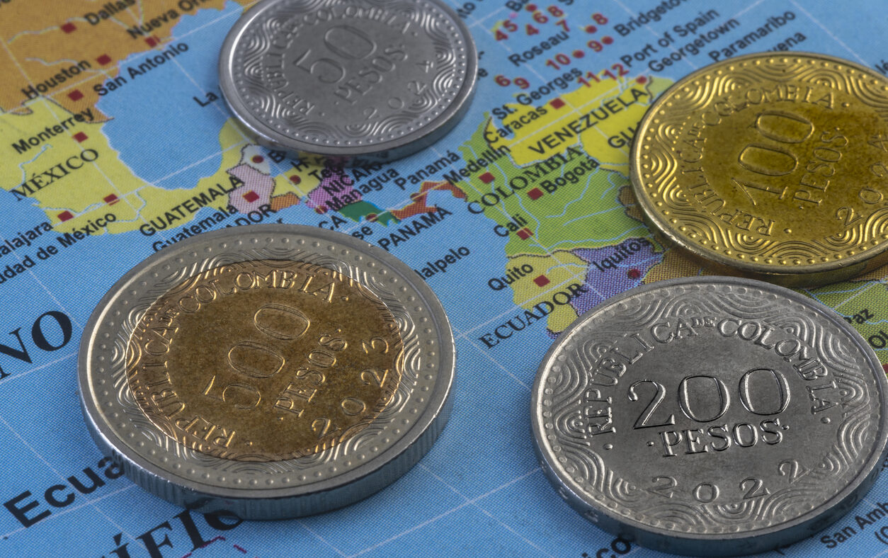 Colombian coins on a map of America