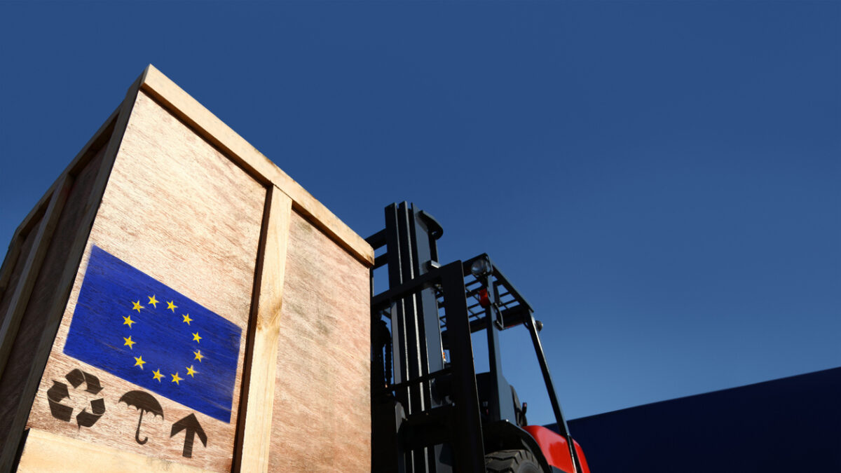 Forklift truck with boxes on pallet. Cargo