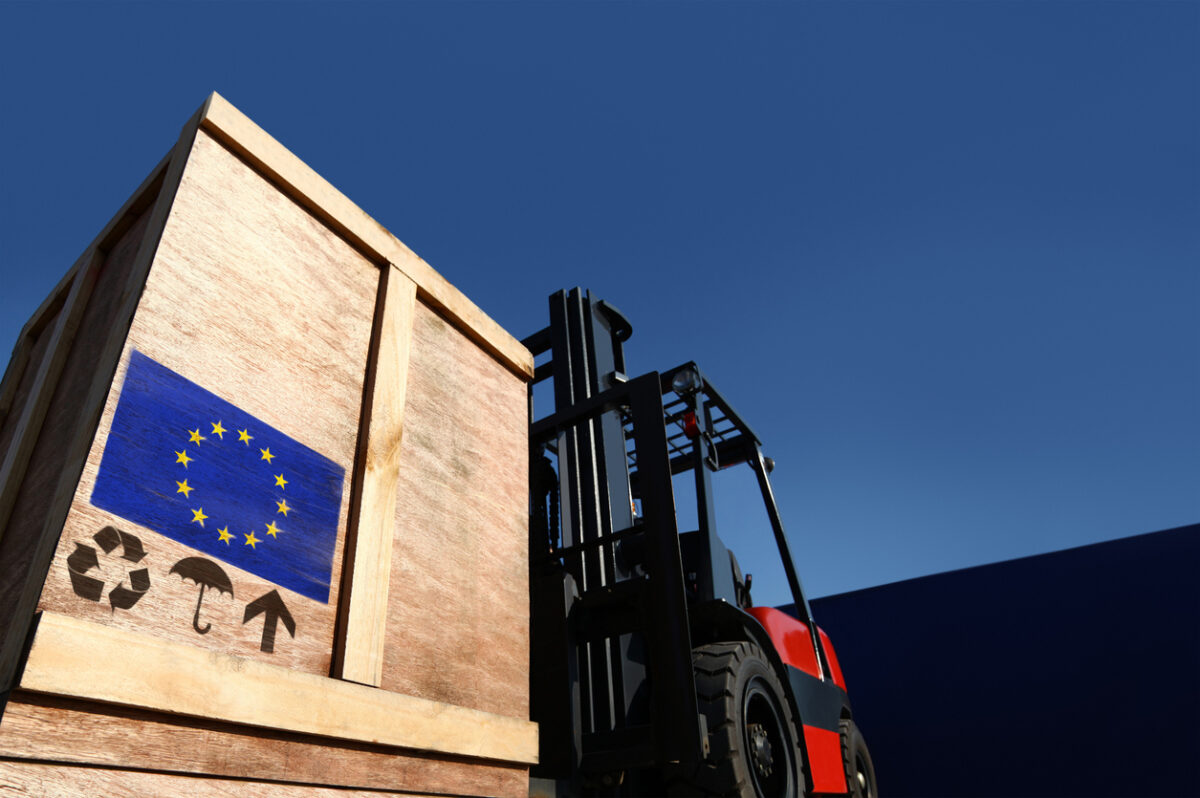 Forklift truck with boxes on pallet. Cargo