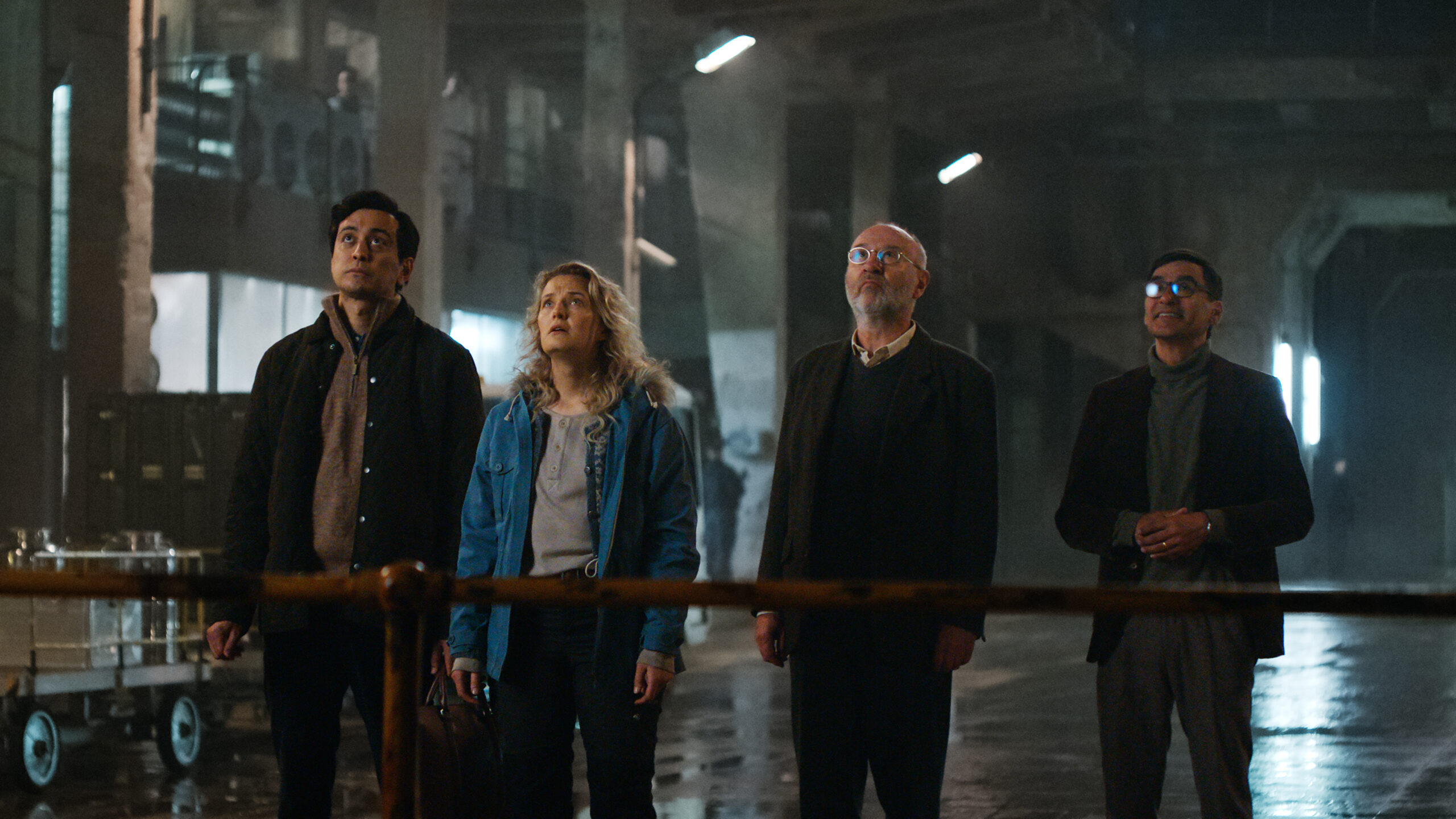 Troll 2. (L to R) Kim Falck as Andreas Isaksen, Ine Marie Wilmann as Nora Tidemann, Jon Ketil Johnsen as Professor Møller and Duc Mai-The as Professor Wangel in Troll 2. Cr. Courtesy of Netflix © 2024