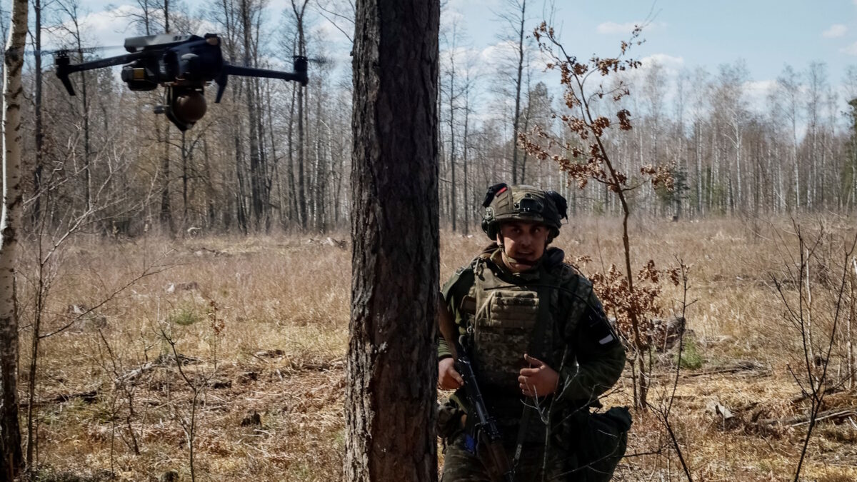 FILE PHOTO: Yevhen Yushchenko a young recruit of the 28th Knights of the Winter Campaign Separate Mechanised Brigade of the Ukrainian Armed Forces hides from a drone during an exercise, amid Russia's attack on Ukraine, in Kyiv region, Ukraine April 4, 2025. REUTERS