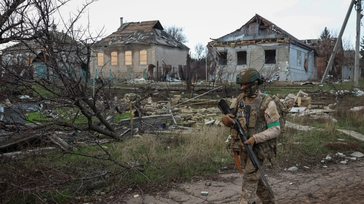 A serviceman of the 49th Separate Assault Battalion Carpathian Sich of the Armed Forces of Ukraine walks near buildings damaged by Russian military strike, amid Russia's attack on Ukraine, in the frontline town of Kostiantynivka in Donetsk region, Ukraine December 7, 2025