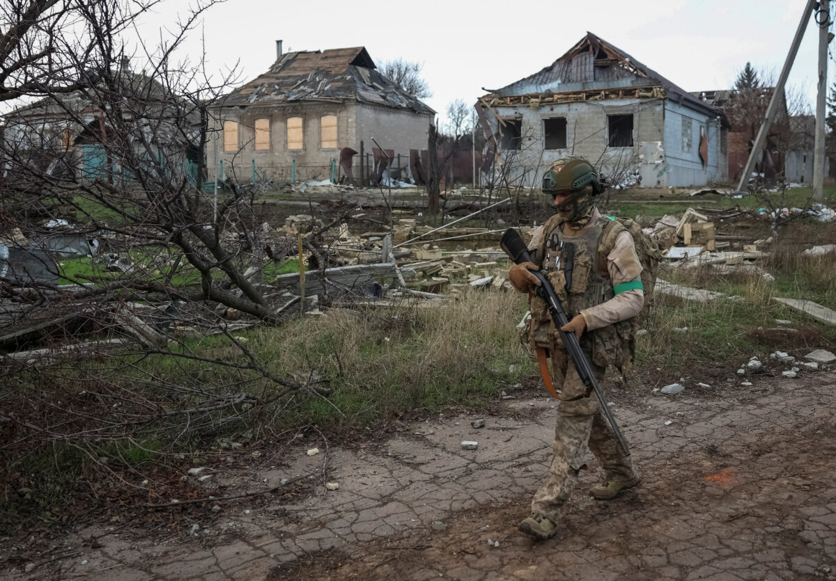 A serviceman of the 49th Separate Assault Battalion Carpathian Sich of the Armed Forces of Ukraine walks near buildings damaged by Russian military strike, amid Russia's attack on Ukraine, in the frontline town of Kostiantynivka in Donetsk region, Ukraine December 7, 2025